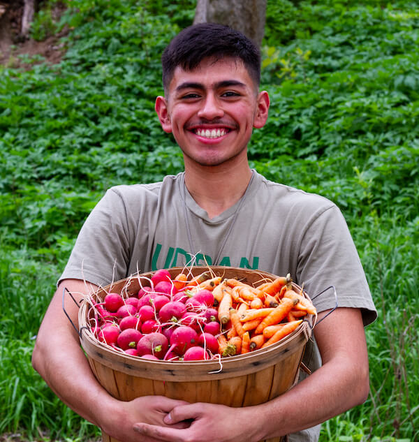 South Austin Intern preparing to share the bounty from the farm.