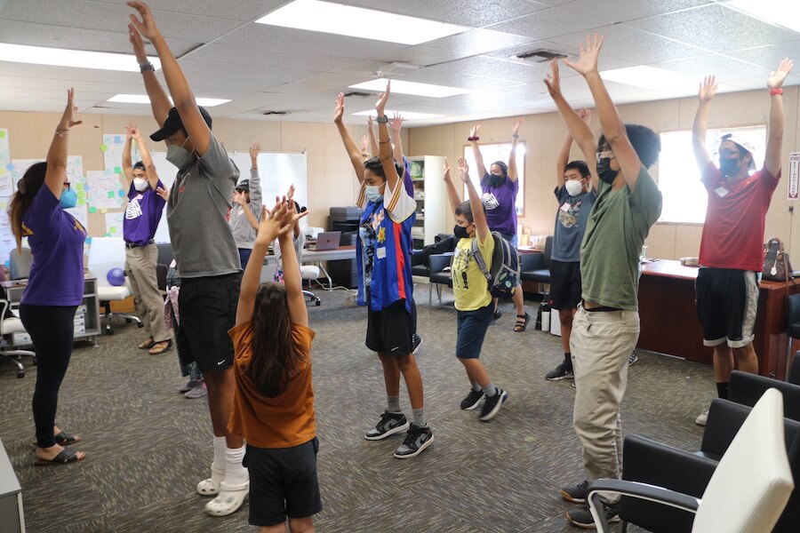 Filipino Summer Program volunteers and participants learning traditional Filipino dances